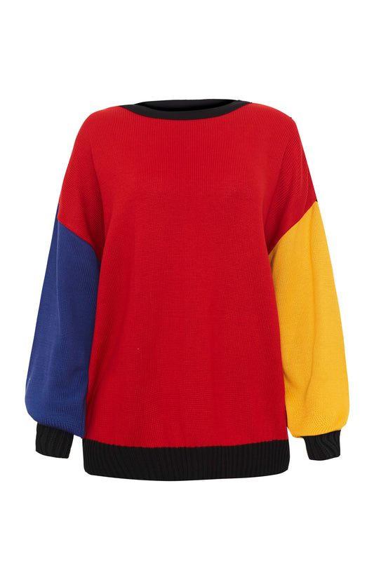 Colorful jumper with bold colors, with a mix of five different colors, black as the primary covering the back of the cardigan the hands and the buttons inseams, with one arm yellow, one arm blue, and the front red, looking like a Mondrian painting. Cardigan fits from S to 2XL, fits plus size cardigan.